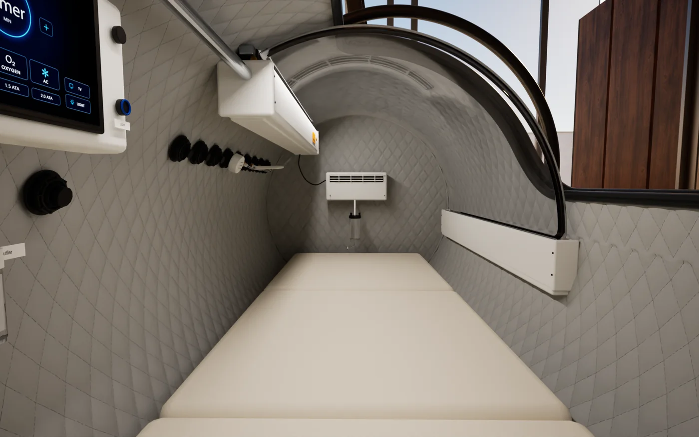 The cabin of the Superhuman L1 seen lying down: White quilted walls, the control panel by your head, the mattress and the door